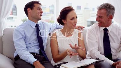 Attractive businesswoman discussing with colleagues