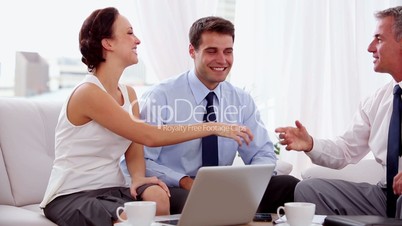 Businessman shaking hands of business people