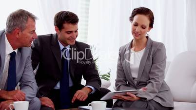 Attractive businesswoman working on a tablet