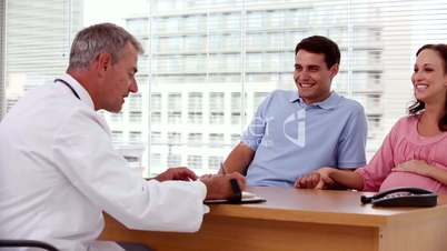 Doctor writing something for his patients