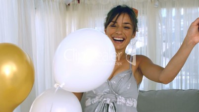 Woman playing with balloon