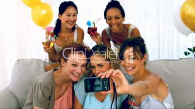 Women taking pictures at party
