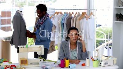 Woman on the phone giving instructions to a colleague