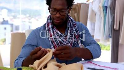 Fashion designer working with a fabric