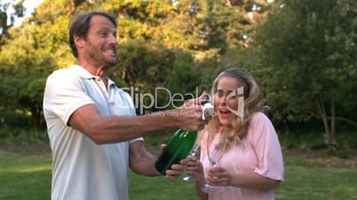 Man opening a bottle of champagne
