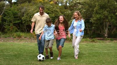 Family playing football