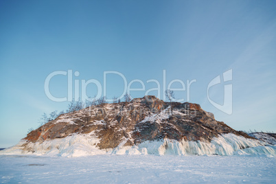outdoor view of coastal cliffs at frozen baikal lake in winter