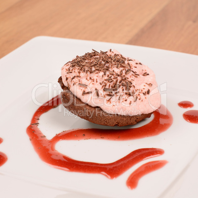 Sweet cake with strawberry cream and chocolate