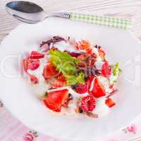 salad with dressing and fresh raspberry