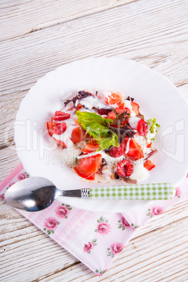 salad with dressing and fresh raspberry