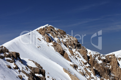 top of mountains with snow cornice