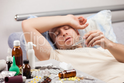 Unwell man patient lying down bed