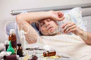 Unwell man patient lying down bed