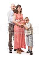 Little smiling child boy with father and pregnant mother