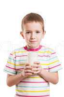 Smiling child boy drinking milk