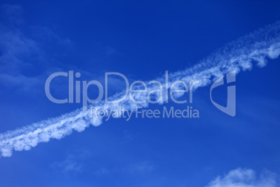 blue sky with contrail