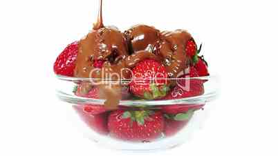 Chocolate on strawberries in glass bowl