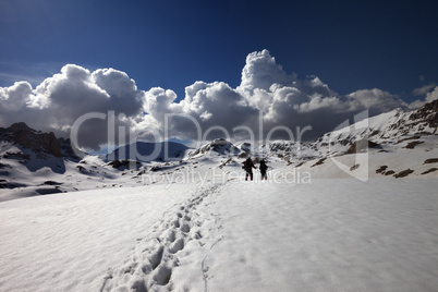 hikers on snow plateau