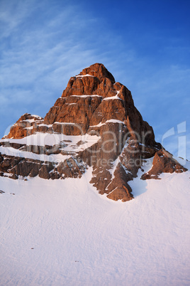 snowy rocks at sunrise