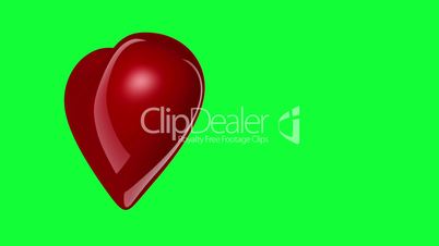 Red heart rotating on the greenscreen background