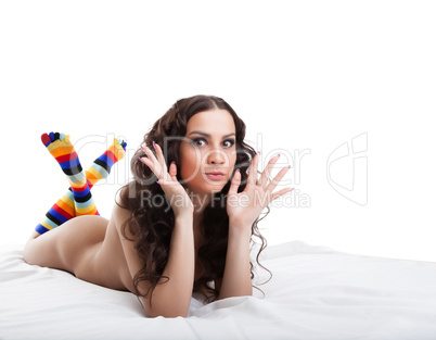 Portrait of young emotional woman posing in studio