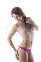 Portrait of young slim woman posing in panties