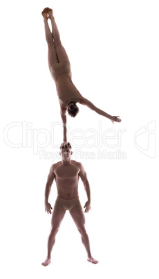 Sporty couple showing acrobatic support