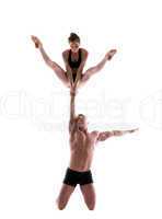 Attractive young people showing acrobatic trick