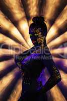 Portrait of attractive naked woman with UV makeup