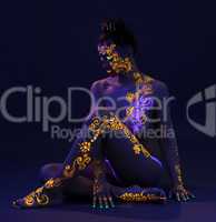 Graceful woman with glowing pattern on body