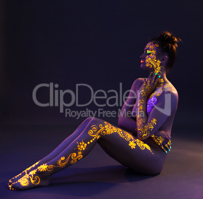 Image of sexy brunette with UV pattern on body