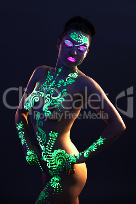 Portrait of sexual woman with UV glowing makeup