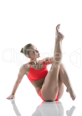 Athletic young woman posing in studio