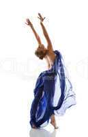 Pretty young blonde dancing with blue cloth