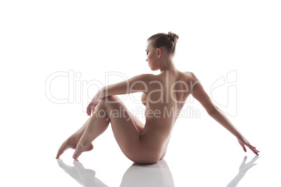 Elegant nude girl posing in studio