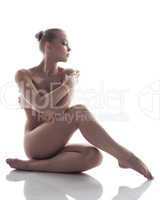 Image of pretty naked woman posing in studio