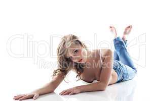 Attractive slim girl posing lying in studio