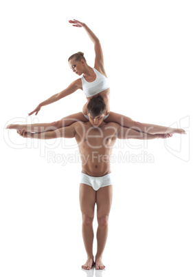 Image of attractive acrobats posing in studio