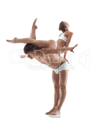 Attractive young gymnasts posing in studio