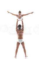 Image of two young gymnasts - man holds slim girl