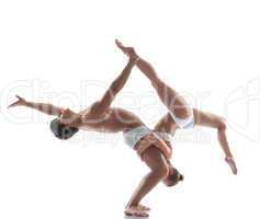 Two flexible acrobats posing in studio