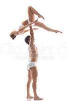 Image of graceful acrobats - strong man holds girl
