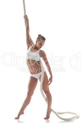 Young aerialist with rope isolated on white