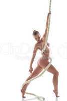 Image of sensual naked woman posing with rope