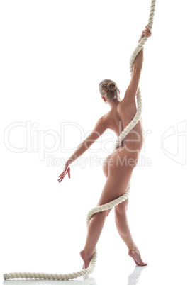 Image of flexible nude model posing with rope