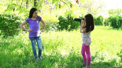 Two girls taking pictures