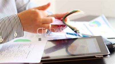 Businesswoman hands counting and calculating money