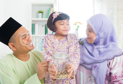 Southeast Asian Malay family saving money
