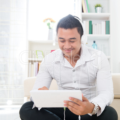 Asian man using tablet pc