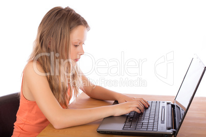 Young girl working on a laptop